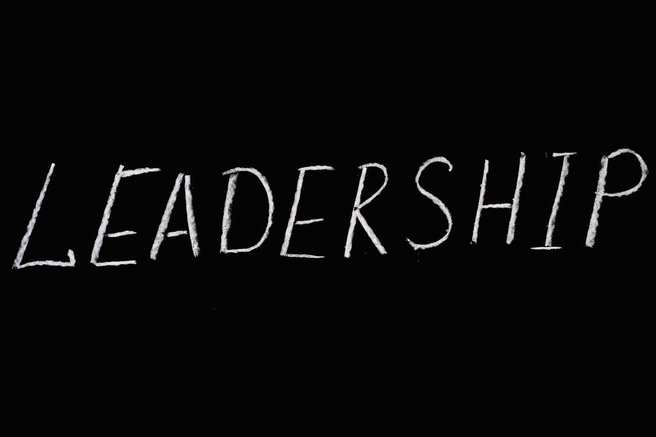 heros-img Chalk text spelling 'Leadership' on a blackboard, symbolizing guidance and authority.